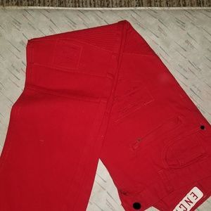 Red distressed jeans